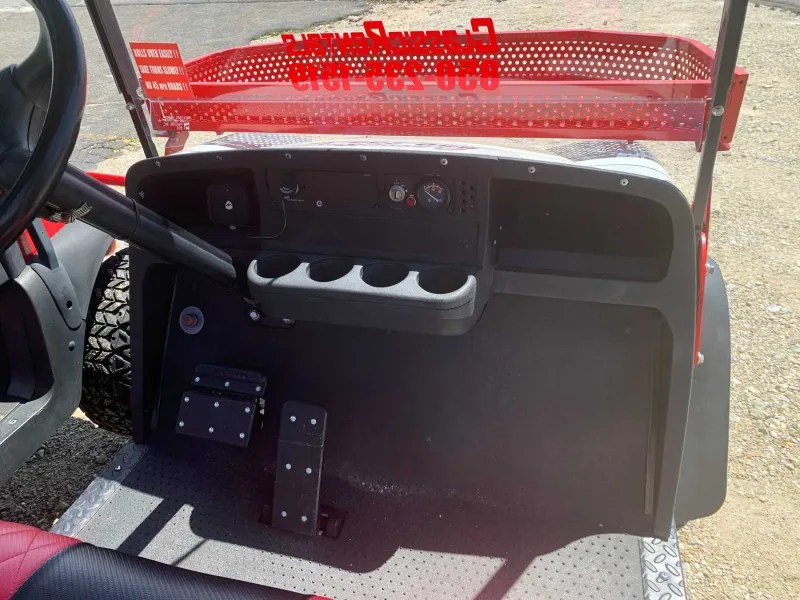 Golf cart dashboard with cup holders and a gauge